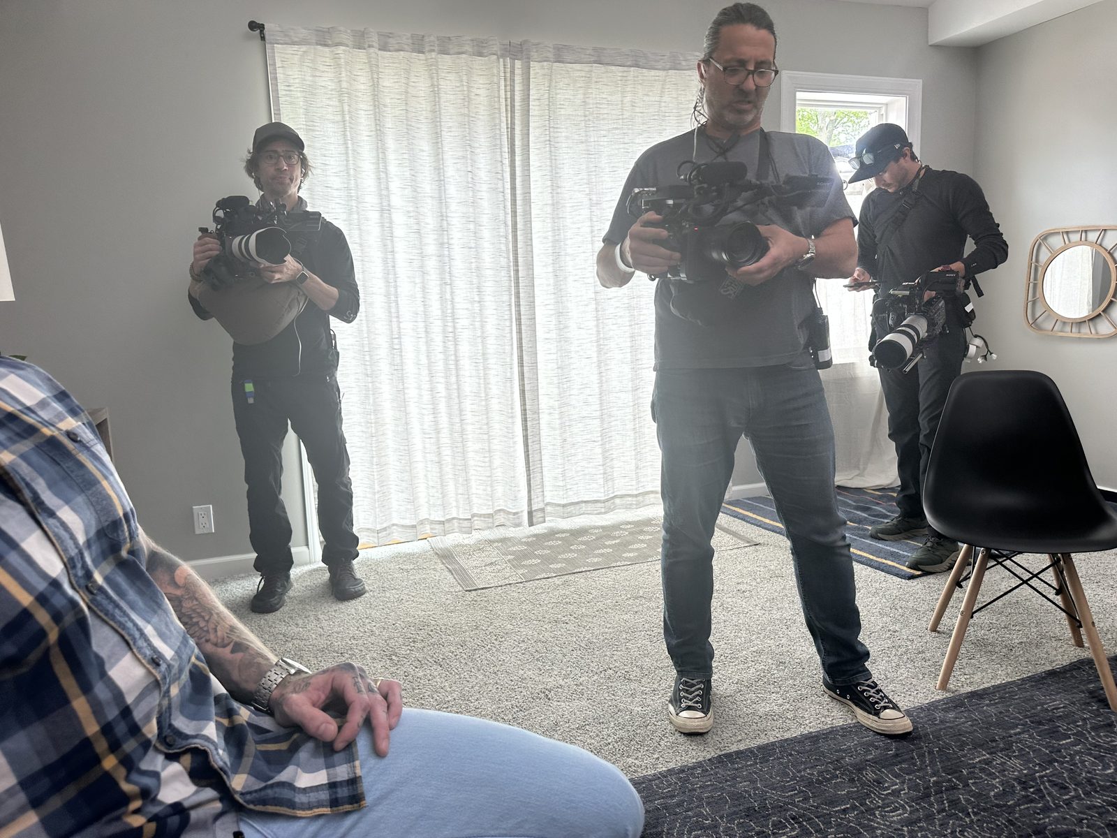 Camera team preparing equipment during intervention production filming